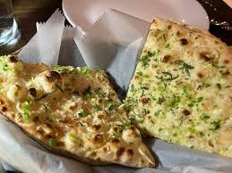 Rutba Indian Kitchen signature dishes Butter ChickenLamb Rogan JoshGarlic Naan